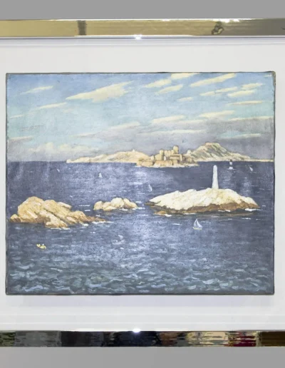 Marine représentant des îles et un phare, encadrée d'un profil effet métallique chrome